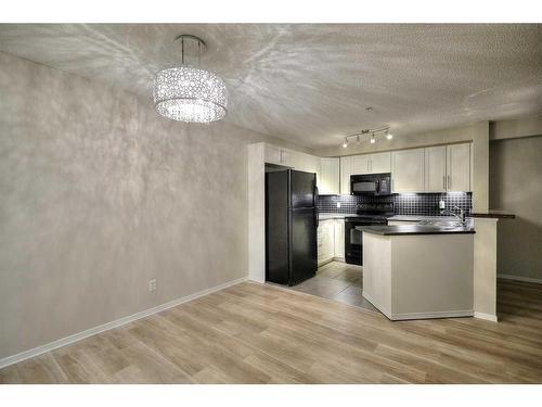 2113-16969 24 Street Sw, Calgary, AB - Indoor Photo Showing Kitchen