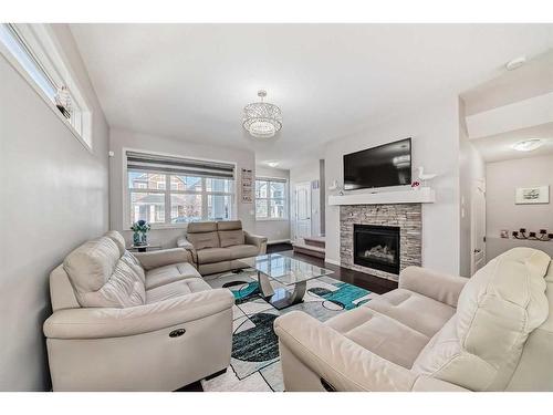 17 Red Embers Row Ne, Calgary, AB - Indoor Photo Showing Living Room With Fireplace