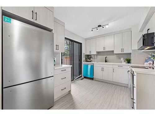 104-9803 24 Street Sw, Calgary, AB - Indoor Photo Showing Kitchen