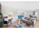 104-9803 24 Street Sw, Calgary, AB  - Indoor Photo Showing Living Room 