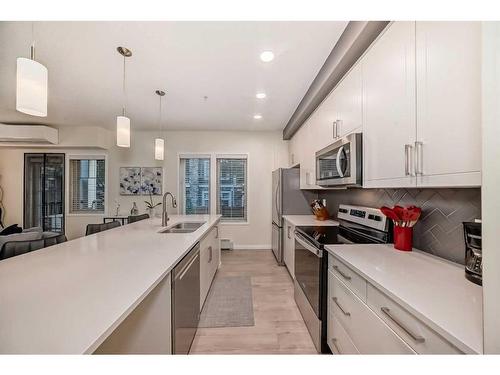 104-30 Mahogany Mews Se, Calgary, AB - Indoor Photo Showing Kitchen With Double Sink With Upgraded Kitchen