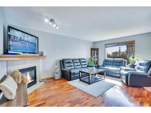 397 Panamount Drive Nw, Calgary, AB - Indoor Photo Showing Living Room With Fireplace