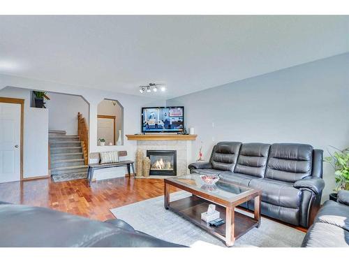 397 Panamount Drive Nw, Calgary, AB - Indoor Photo Showing Living Room With Fireplace