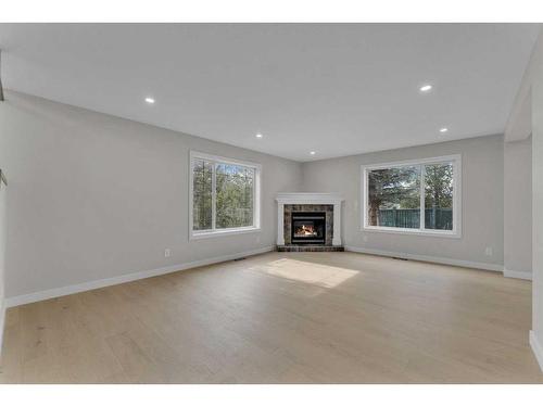 118 Springmere Drive, Chestermere, AB - Indoor Photo Showing Living Room With Fireplace