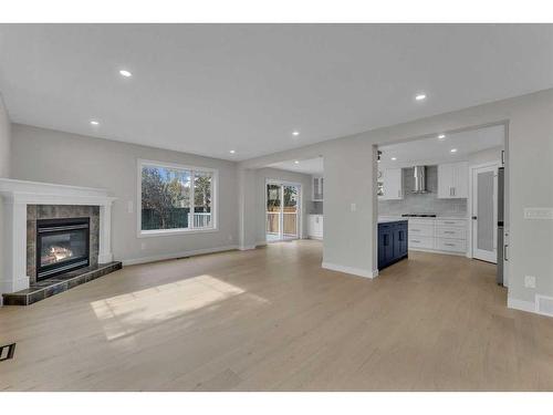 118 Springmere Drive, Chestermere, AB - Indoor Photo Showing Living Room With Fireplace