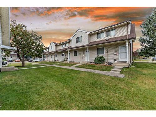 122-1555 Falconridge Drive Ne, Calgary, AB - Outdoor With Deck Patio Veranda With Facade