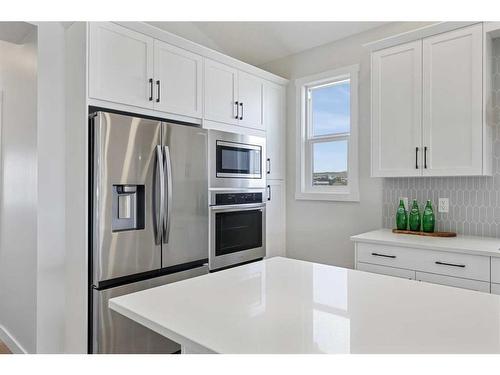 354 Baywater Common Sw, Airdrie, AB - Indoor Photo Showing Kitchen With Stainless Steel Kitchen