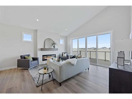 354 Baywater Common Sw, Airdrie, AB - Indoor Photo Showing Living Room With Fireplace