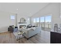 354 Baywater Common Sw, Airdrie, AB  - Indoor Photo Showing Living Room With Fireplace 