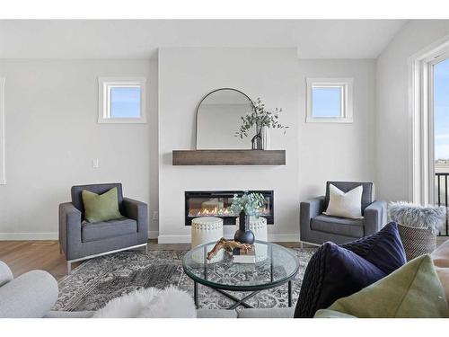 354 Baywater Common Sw, Airdrie, AB - Indoor Photo Showing Living Room With Fireplace