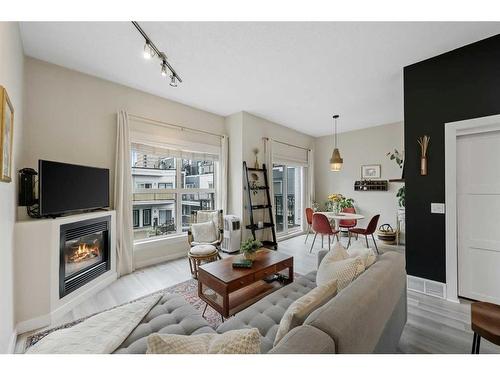 32-605 15 Avenue Sw, Calgary, AB - Indoor Photo Showing Living Room With Fireplace