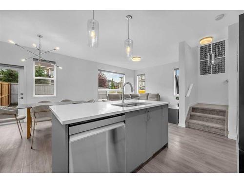 704 South Point Heath Sw, Airdrie, AB - Indoor Photo Showing Kitchen With Double Sink With Upgraded Kitchen