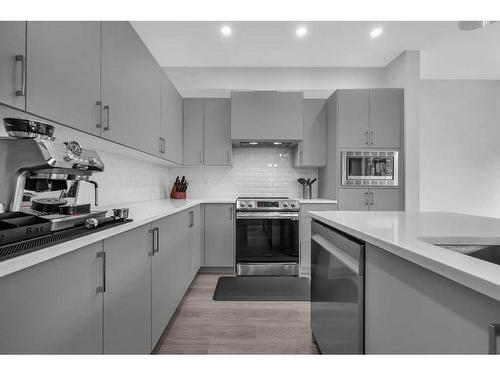 704 South Point Heath Sw, Airdrie, AB - Indoor Photo Showing Kitchen With Stainless Steel Kitchen With Upgraded Kitchen