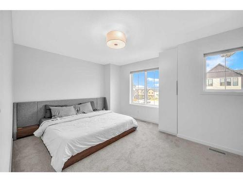 704 South Point Heath Sw, Airdrie, AB - Indoor Photo Showing Bedroom