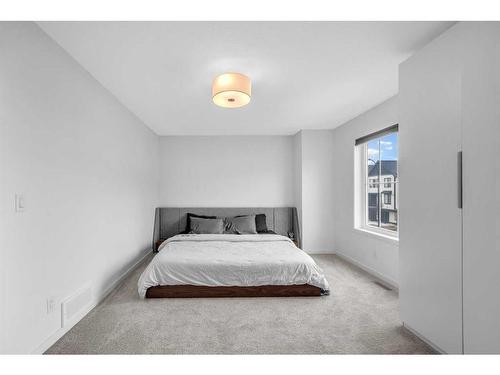 704 South Point Heath Sw, Airdrie, AB - Indoor Photo Showing Bedroom