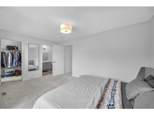 704 South Point Heath Sw, Airdrie, AB - Indoor Photo Showing Bedroom