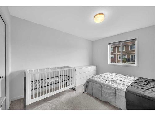 704 South Point Heath Sw, Airdrie, AB - Indoor Photo Showing Bedroom