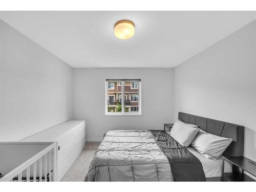 704 South Point Heath Sw, Airdrie, AB - Indoor Photo Showing Bedroom