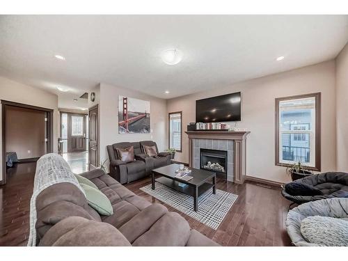 118 Bayview Street Sw, Airdrie, AB - Indoor Photo Showing Living Room With Fireplace