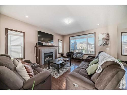 118 Bayview Street Sw, Airdrie, AB - Indoor Photo Showing Living Room With Fireplace