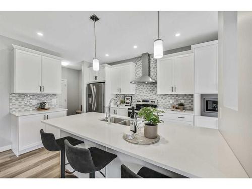 1378 Bayview Crescent Sw, Airdrie, AB - Indoor Photo Showing Kitchen With Stainless Steel Kitchen With Double Sink With Upgraded Kitchen