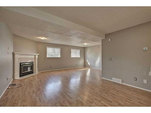 135 Erin Meadow Green Se, Calgary, AB - Indoor With Fireplace