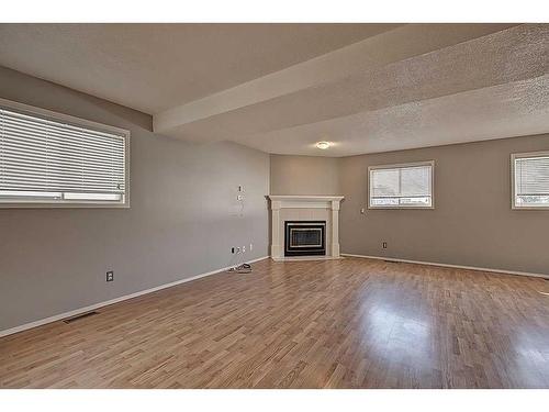 135 Erin Meadow Green Se, Calgary, AB - Indoor With Fireplace