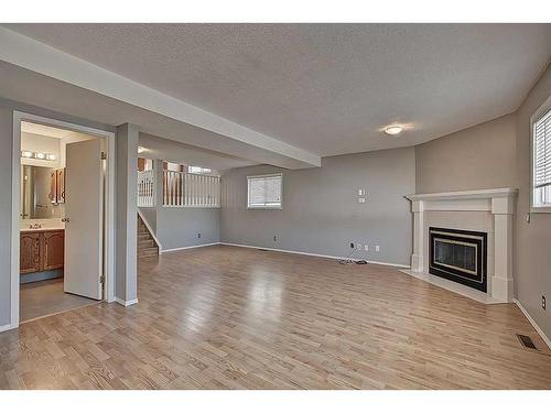 135 Erin Meadow Green Se, Calgary, AB - Indoor With Fireplace