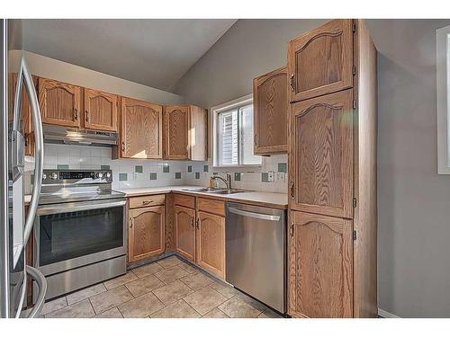 135 Erin Meadow Green Se, Calgary, AB - Indoor Photo Showing Kitchen With Double Sink