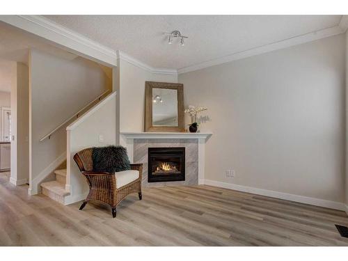 18 Promenade Way Se, Calgary, AB - Indoor With Fireplace