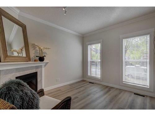 18 Promenade Way Se, Calgary, AB - Indoor With Fireplace