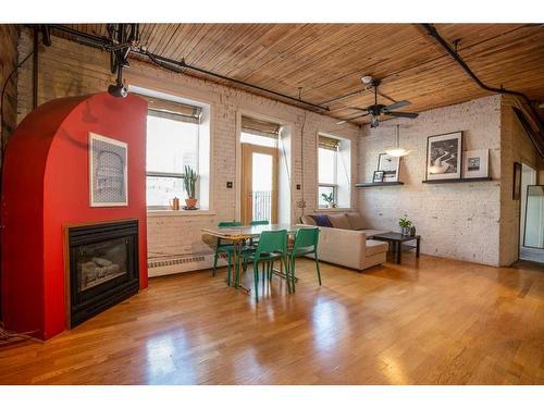 208-240 11 Avenue Sw, Calgary, AB - Indoor Photo Showing Other Room With Fireplace