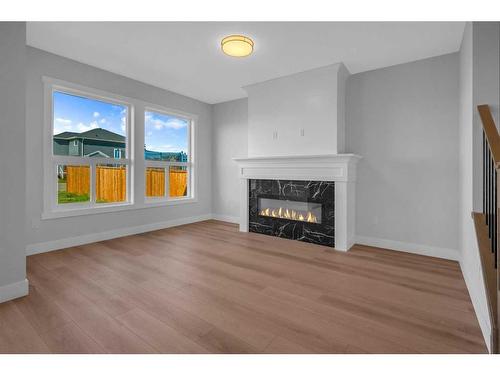 1427 Aldrich Place, Carstairs, AB - Indoor Photo Showing Living Room With Fireplace