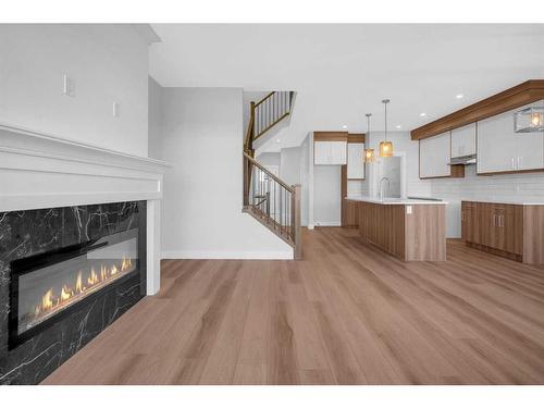 1427 Aldrich Place, Carstairs, AB - Indoor Photo Showing Living Room With Fireplace