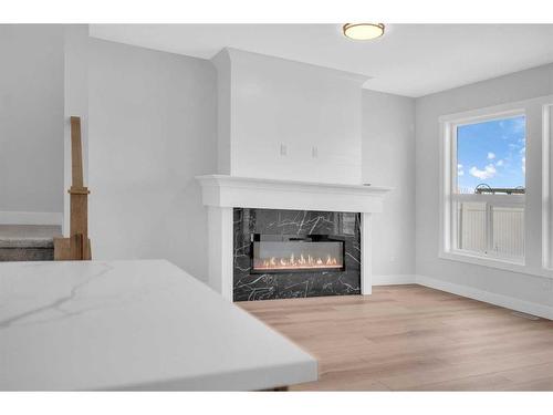 1421 Aldrich Place, Carstairs, AB - Indoor Photo Showing Living Room With Fireplace