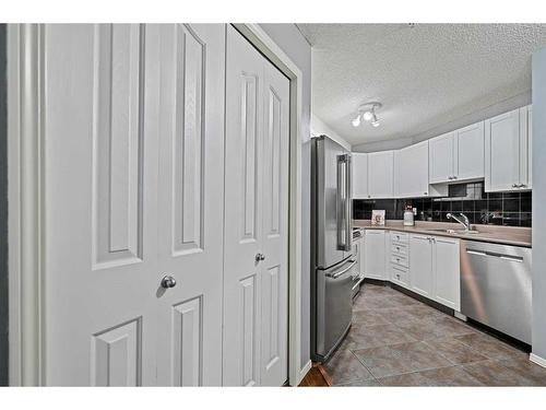 2218-2371 Eversyde Avenue Sw, Calgary, AB - Indoor Photo Showing Kitchen With Double Sink