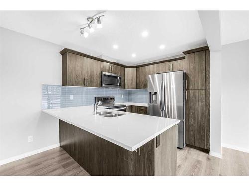 1510 Carrington Blvd, Calgary, AB - Indoor Photo Showing Kitchen With Double Sink With Upgraded Kitchen