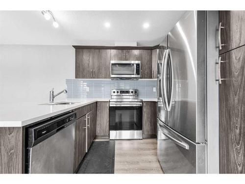 1510 Carrington Blvd, Calgary, AB - Indoor Photo Showing Kitchen With Upgraded Kitchen