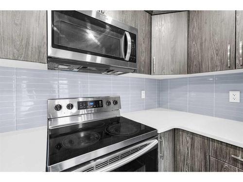 1510 Carrington Blvd, Calgary, AB - Indoor Photo Showing Kitchen With Upgraded Kitchen