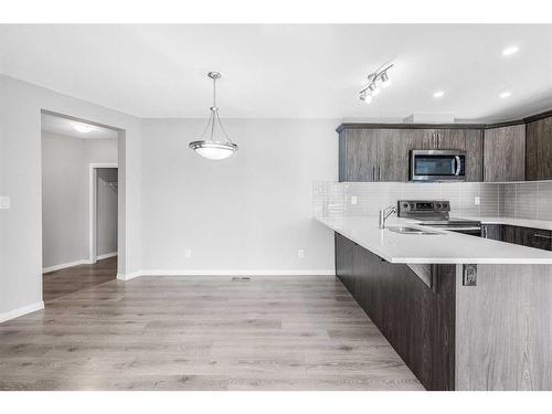 1510 Carrington Blvd, Calgary, AB - Indoor Photo Showing Kitchen With Upgraded Kitchen