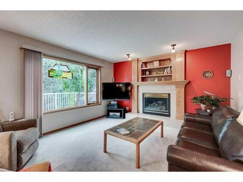 246 Douglas Ridge Mews Se, Calgary, AB - Indoor Photo Showing Living Room With Fireplace