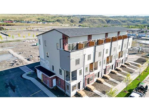 312-156 Park Street, Cochrane, AB - Outdoor With Body Of Water