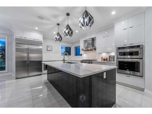 102 Malibou Road Sw, Calgary, AB - Indoor Photo Showing Kitchen With Upgraded Kitchen