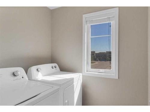 283 Carrington Circle Nw, Calgary, AB - Indoor Photo Showing Laundry Room