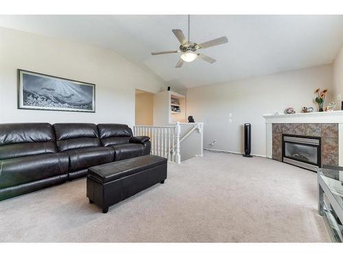 303 Royal Birch View Nw, Calgary, AB - Indoor Photo Showing Living Room With Fireplace