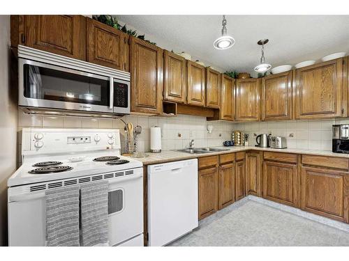 3935 Point Mckay Road Nw, Calgary, AB - Indoor Photo Showing Kitchen With Double Sink