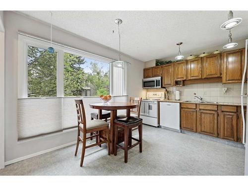 3935 Point Mckay Road Nw, Calgary, AB - Indoor Photo Showing Kitchen With Double Sink