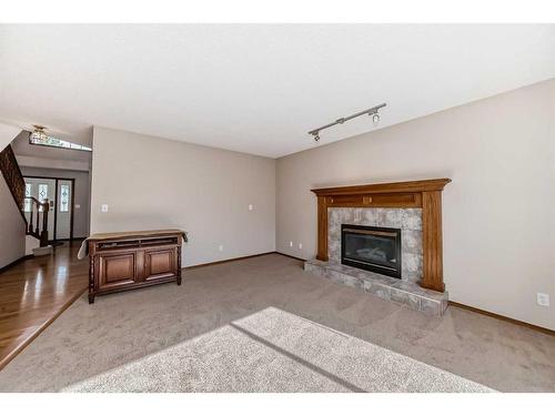 529 Diamond Court Se, Calgary, AB - Indoor Photo Showing Living Room With Fireplace