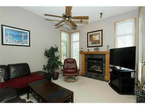 35 Wentworth Gardens Sw, Calgary, AB - Indoor Photo Showing Living Room With Fireplace