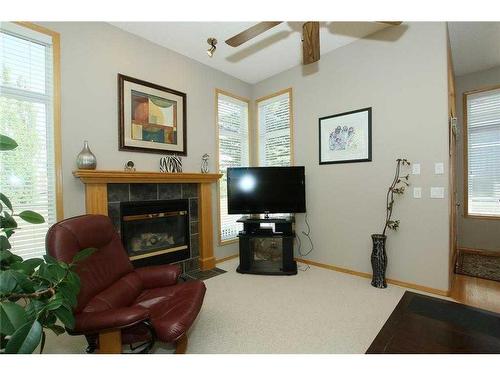 35 Wentworth Gardens Sw, Calgary, AB - Indoor Photo Showing Living Room With Fireplace